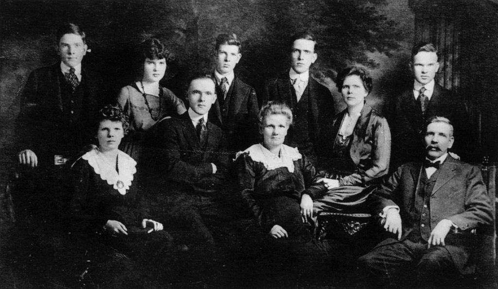 Black and white photo of the Ó Máille family.